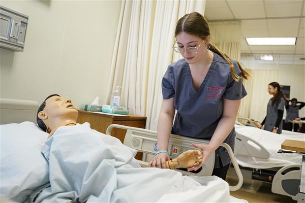 MEDICAL & HEALTH PROFESSIONS students working in lab